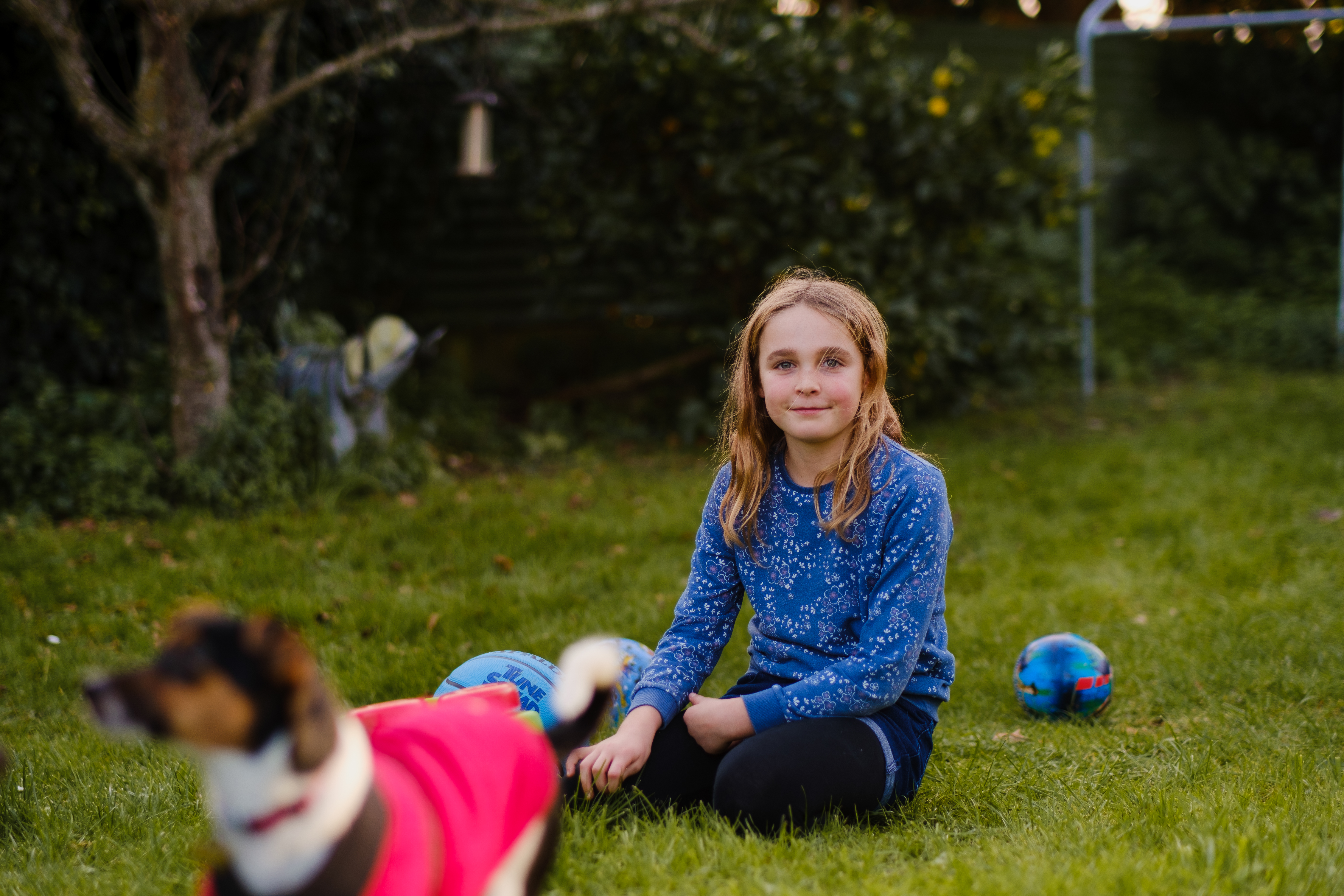 Girl and dog in the backyard