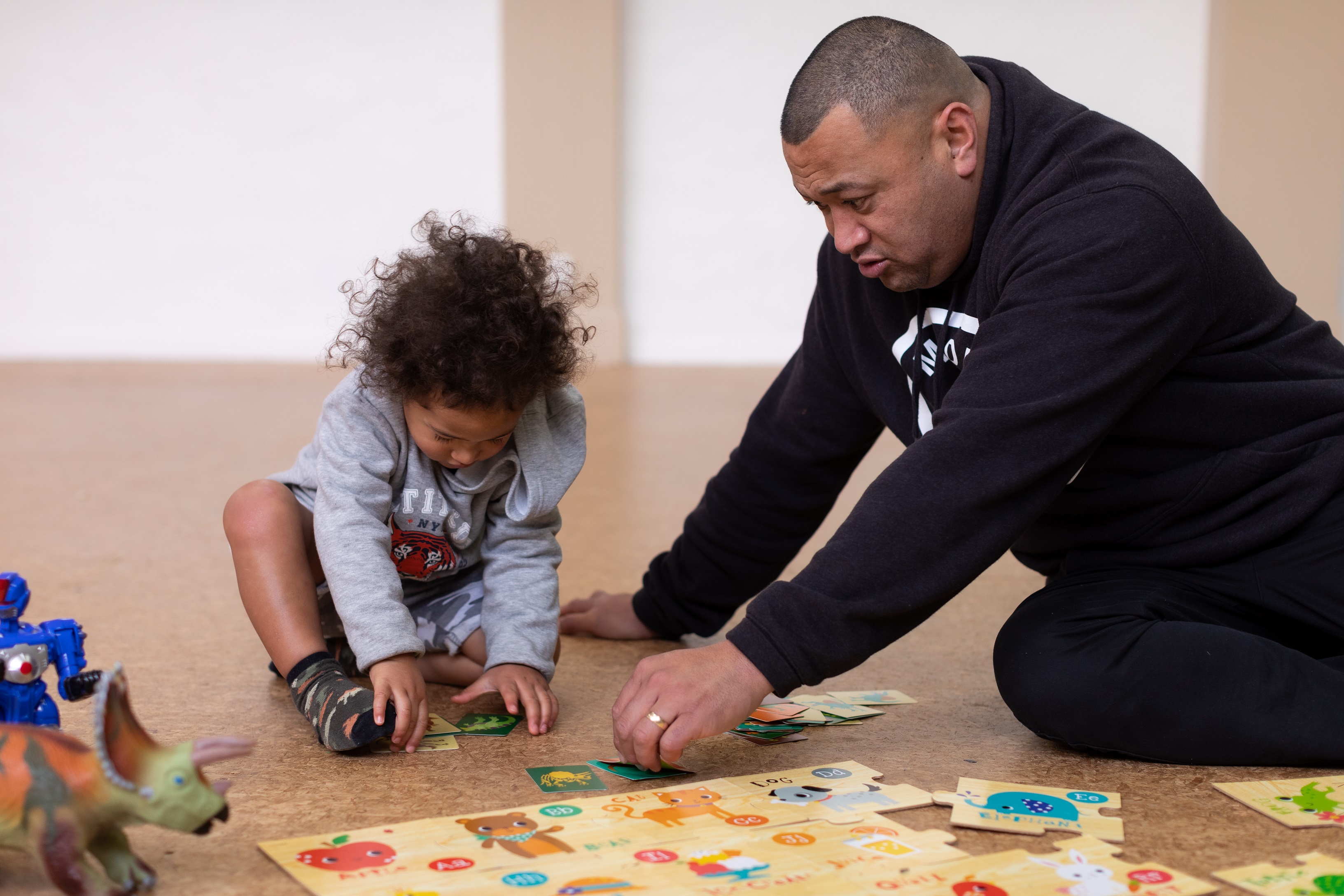 adult and child doing a puzzle