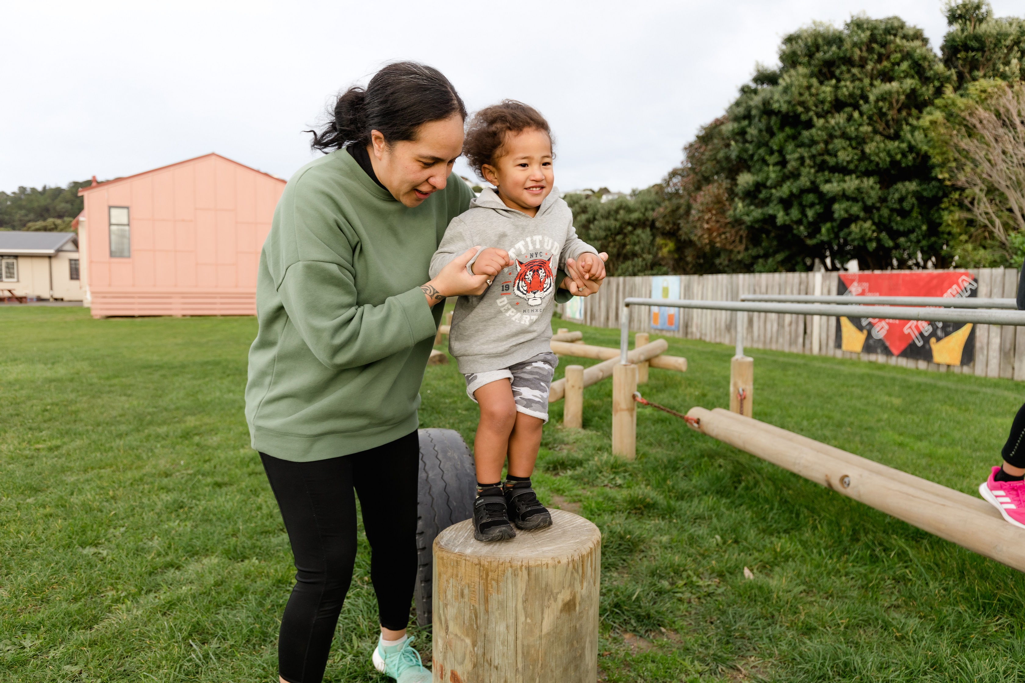 adult and child in a park