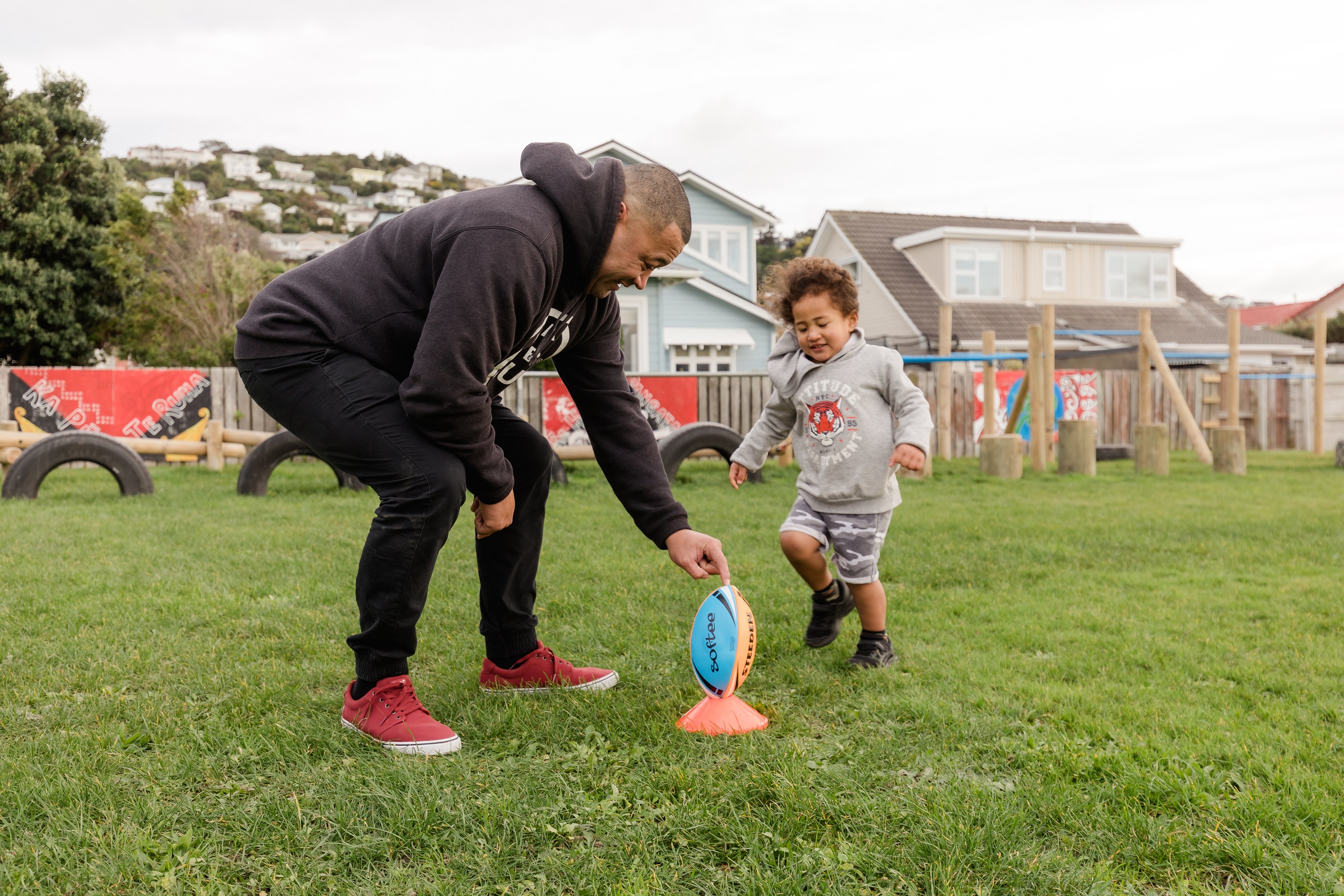 father and son playing rugby