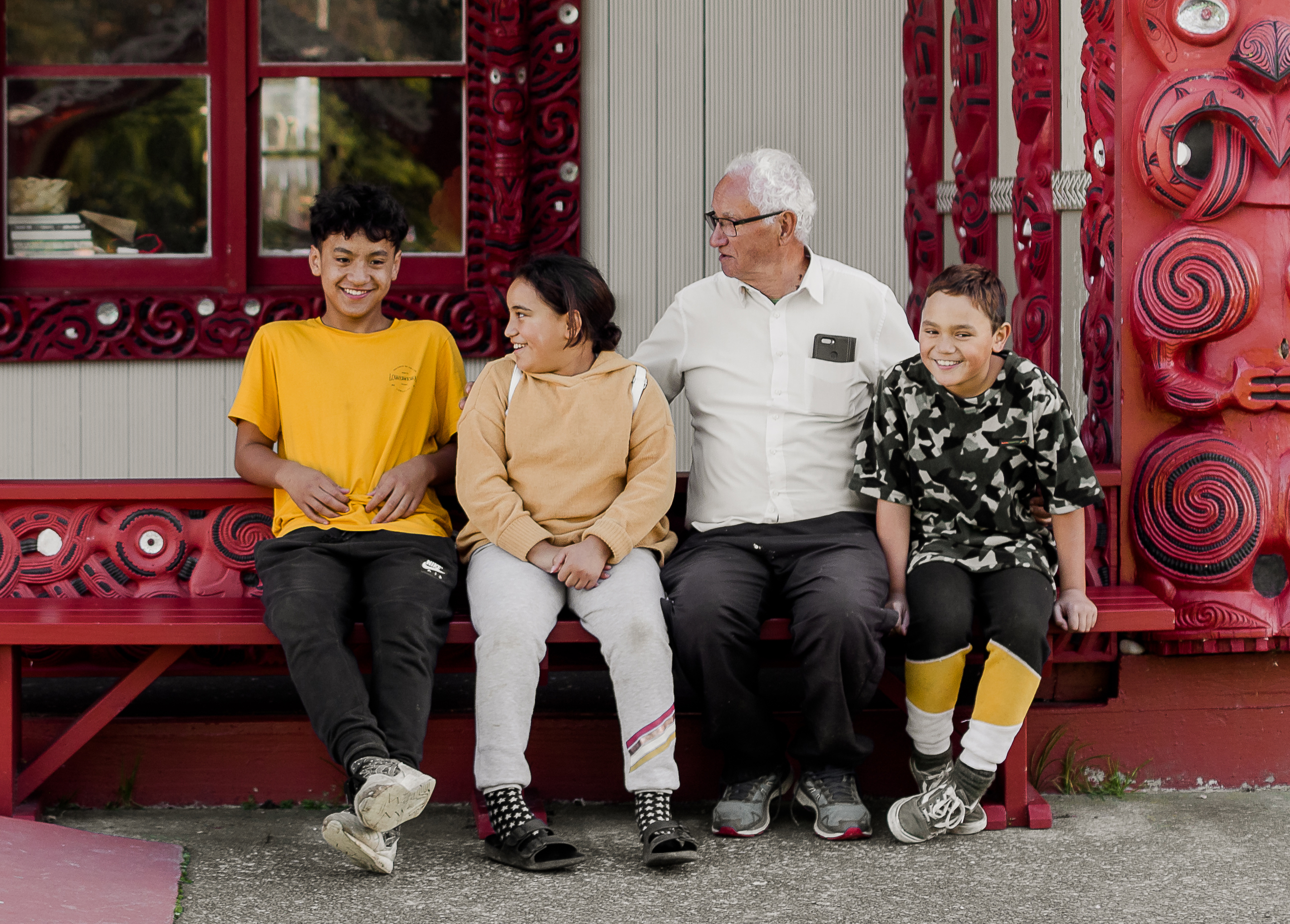 Koro and moko on Marae bench