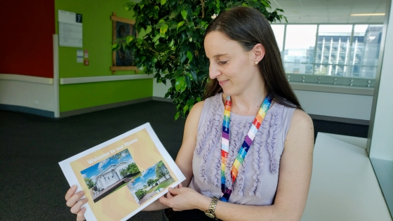 Head and shoulds of Kristin holding her Welcome to Our Home booklet