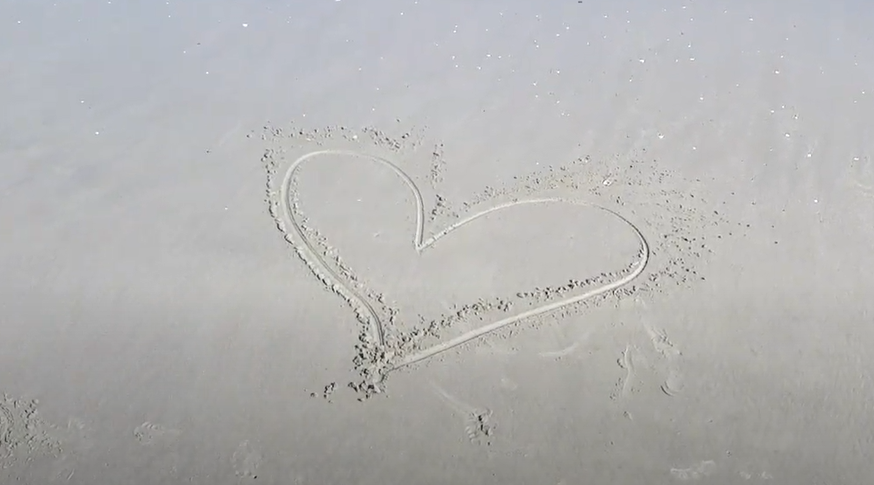 Heart drawn in sand