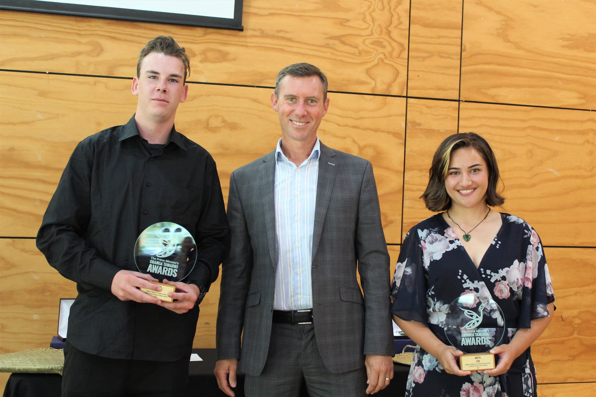 Award recipients Brody Field left and Areta Cox right with local MP Jamie Strange centre