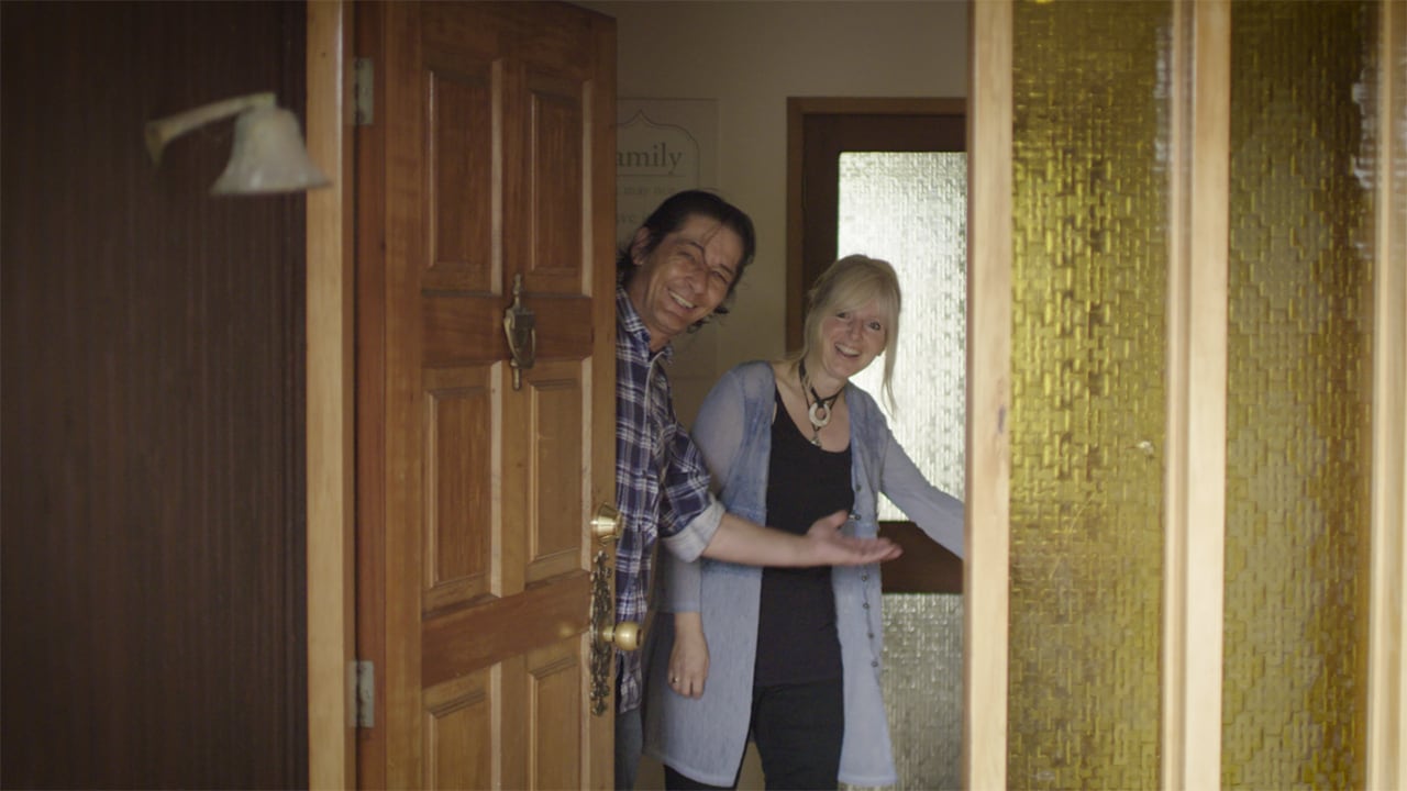 Dave and Tina opening the front door